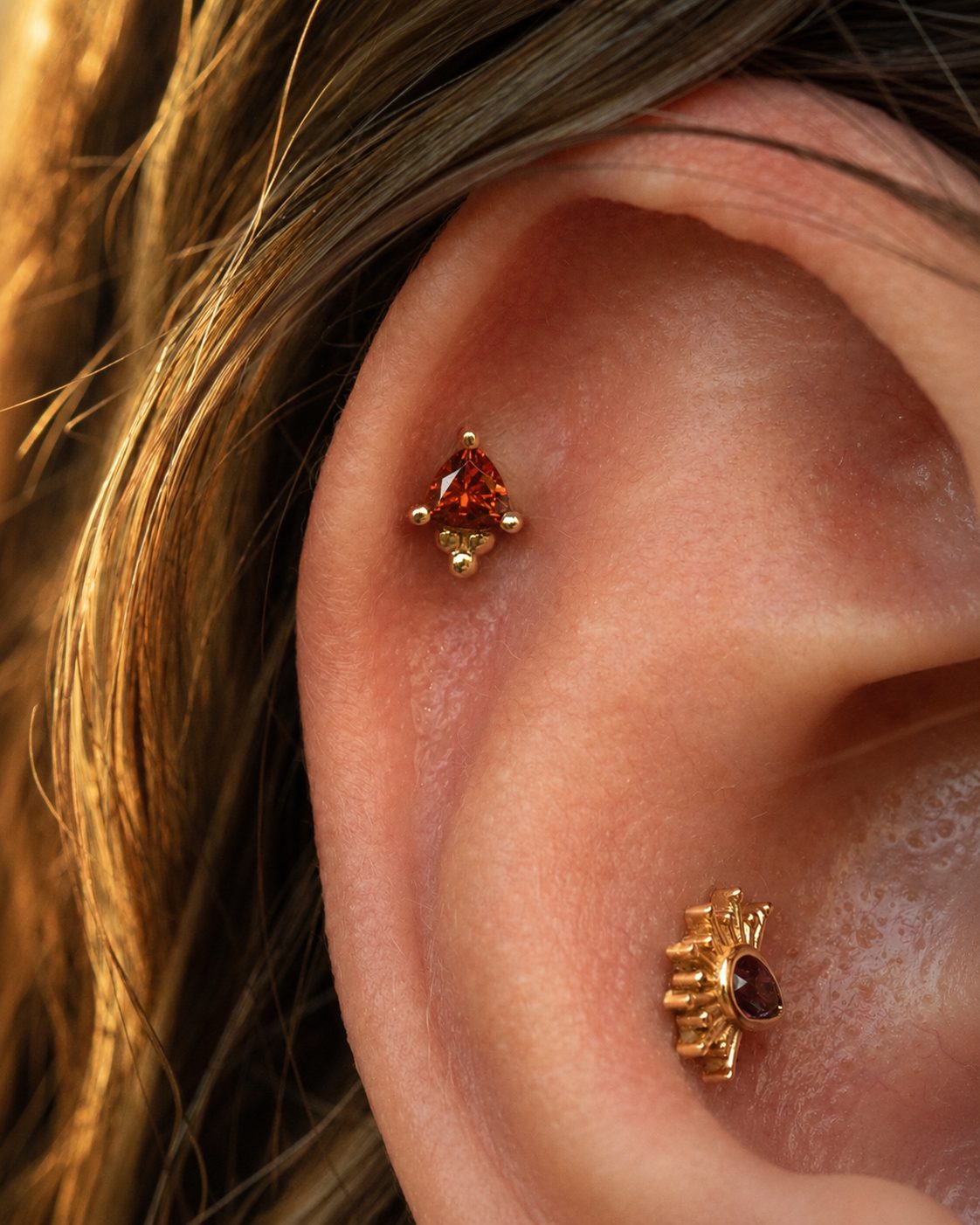 Gold pieces worn in an ear