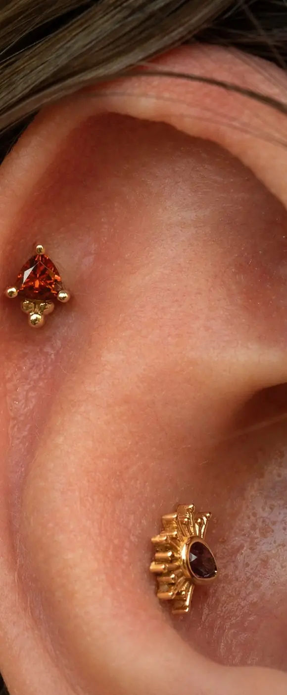 Tiny Borderline, 14k yellow gold, 3x2mm anastasia topaz pear, worn in a conch, pierced at Platinum Point